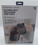 Sharper Image Calming Heat Massaging Knee Wrap Pad 10 Combinations. Fixed Price $31.99.